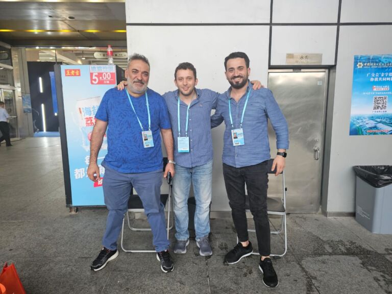 Pioneer Group team with a client at a trade fair in China