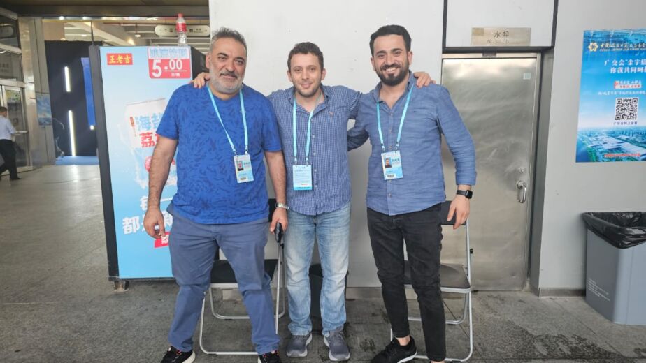 Pioneer Group team with a client at a trade fair in China