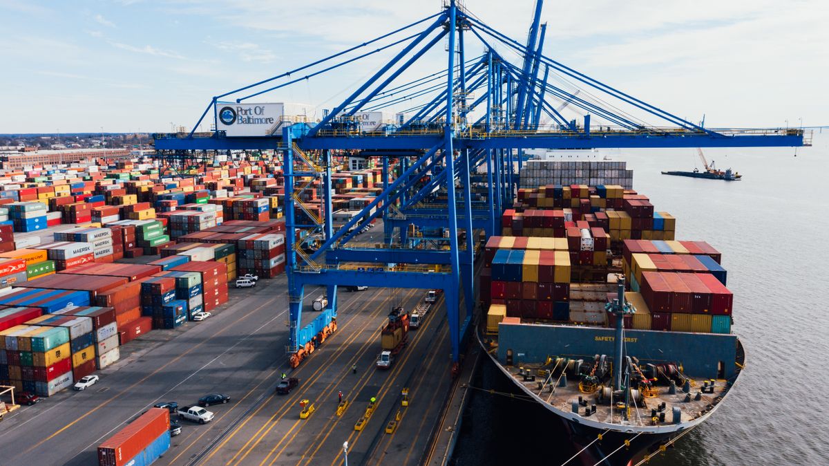Container ship loading at port, the handover point Incoterms explained define