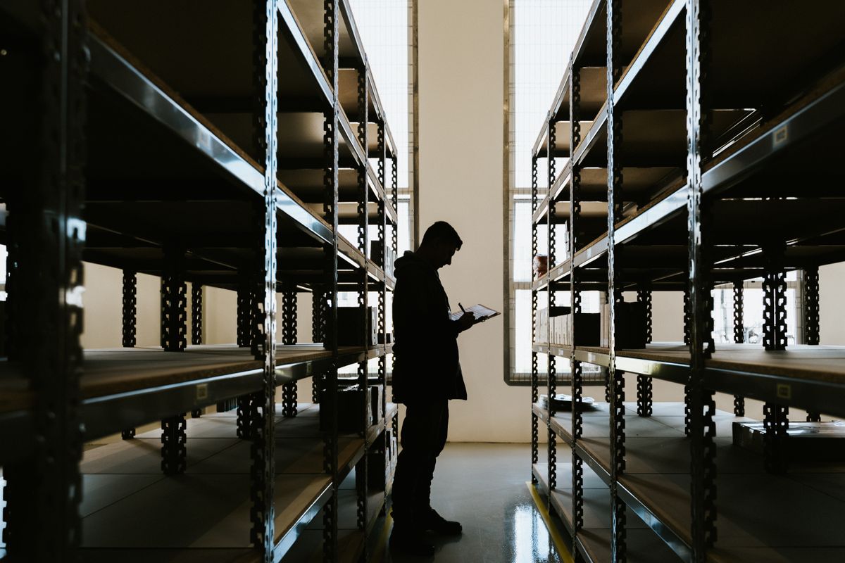 Warehouse inspection with a clipboard, a key check when asking is it safe to buy from China