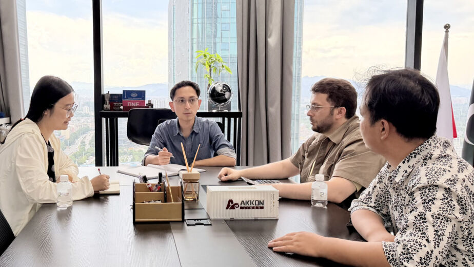 Sea freight vs air freight from China — logistics planning meeting at Pioneer Group Yiwu office