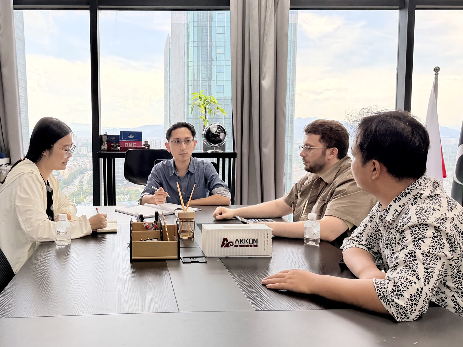 Sea freight vs air freight from China, logistics planning meeting at Pioneer Group Yiwu office