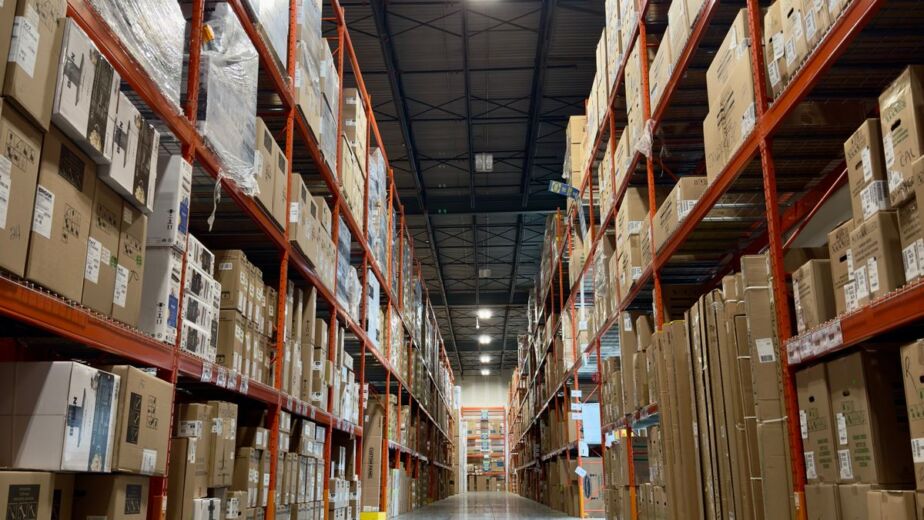 Warehouse aisle of boxed wholesale goods that Yiwu market buyers consolidate into one shipment